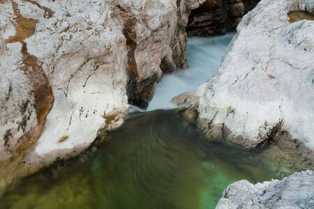 Green rive with rocks in wild natureの写真素材