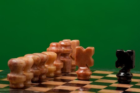 Chess game on board on green backgroundの写真素材