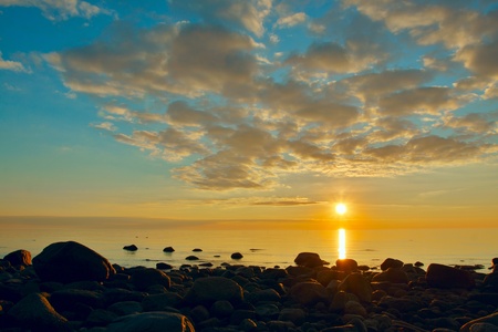 Sunset view over Baltic sea with stonesの写真素材