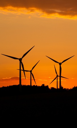 Windmill silhouette on suset backgroundの写真素材