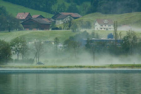 Country side view in Switzerland with fogの写真素材