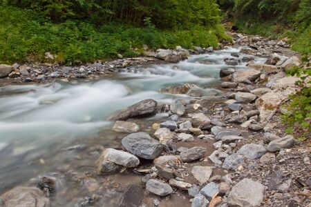 River waterfall with stones in natureの写真素材