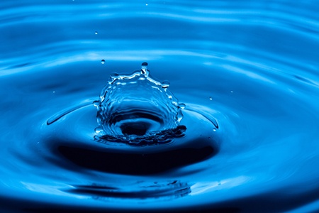 Water drop splashing macro with waves