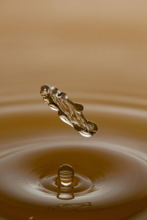 Water drop splashing macro with waves