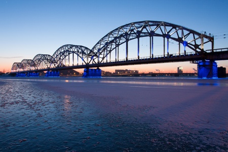 Railway bridge at night in winter close up