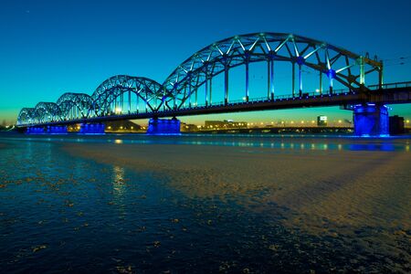 Railway bridge at night in winter close upの写真素材