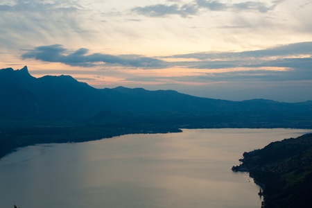 Mountains near lake with cloudsの写真素材