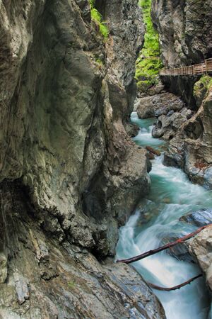Canyon with green river in Austriaの写真素材