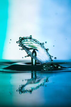 Water drop falling and colliding with another oneの写真素材