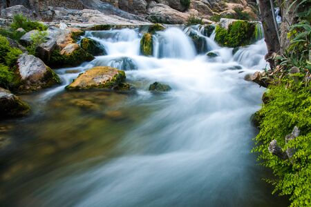 Waterfall with stones in wild natureの写真素材