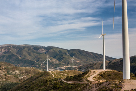 Windmill in mountains on sly backgroundの写真素材