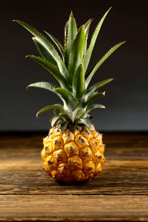 Big pineapple fruit on a black background