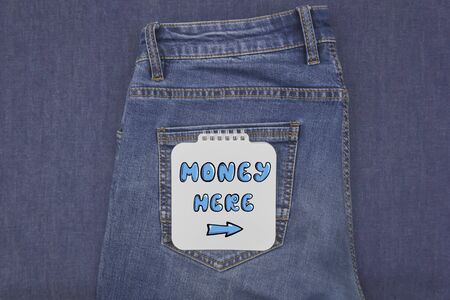 Classic blue jeans on a denim and notebook