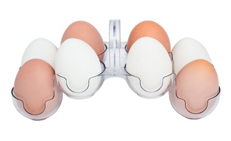 White and Brown Hen's Eggs in a Plastic Transparent Holder isolated on a white backgroundの写真素材