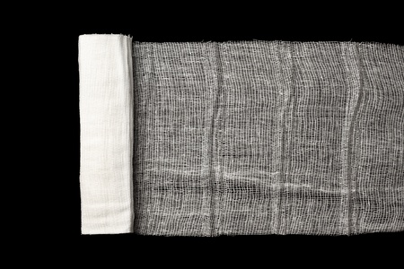 Medicine Bandage isolated on a black backgroundの写真素材