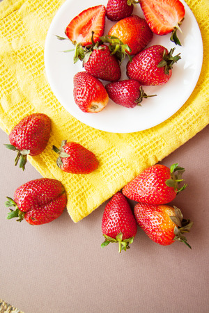 strawberry season: fresh berries on plateの写真素材