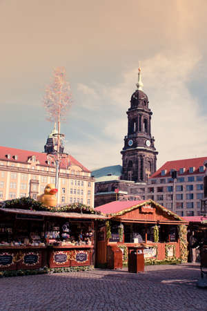 17 May 2019 Dresden, Germany - Fair stalls at Altmarkt. Kreuzkirche bellfry on background.のeditorial素材