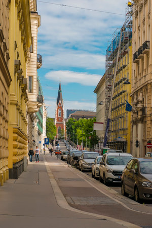 30 May 2019 Vienna, Austria -  Cityscape views of one of Europe's most beautiful town- Vienna. Peoples on streets, urban life in Vienna. Cloudy springtime skyのeditorial素材
