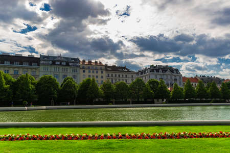 31 May 2019 Vienna, Austria - Belvedere palace`s lake on a cloudy dayのeditorial素材