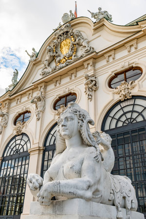 31 May 2019 Vienna, Austria - Belvedere palace, sphynx and cupid statue in the courtyard. Cloudy springtimeのeditorial素材