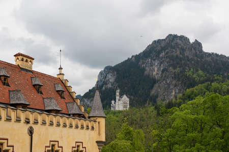 26 May 2019 Fussen, Germany - Hohenschwangau castle among green springtime Alpine mountains.のeditorial素材
