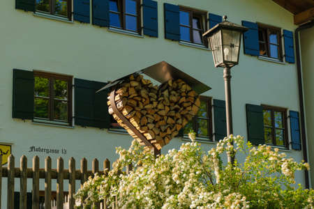 26 May 2019 fussen, Germany - residential district of small town Fussen near Neuschwanstein castle. Small alpine chalets with red tile roofs in mountains. Tidy gardensのeditorial素材