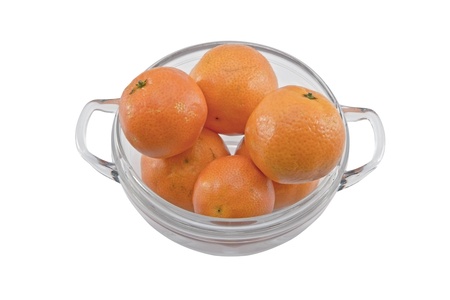 Oranges in a glass bowl isolated on whiteの写真素材
