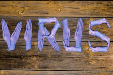 the word virus on the background of old boards.の写真素材