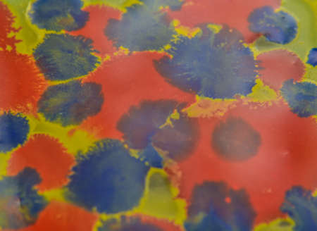 gouache, paint drops of different colors yellow, red, blue.