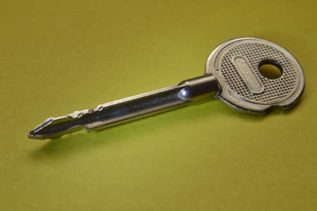 the key is silver on a yellow background.