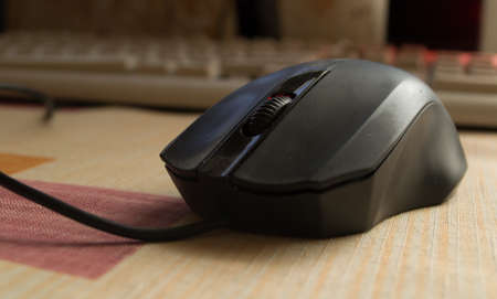 black computer mouse on the desktop.の写真素材