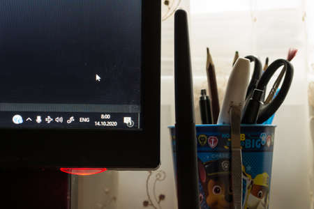 Desk with computer and office supplies.の写真素材