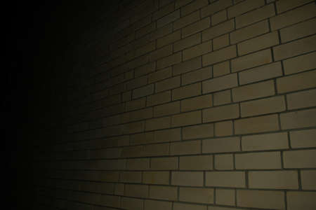 yellow brick brick wall, shooting at night, in the dark.の写真素材