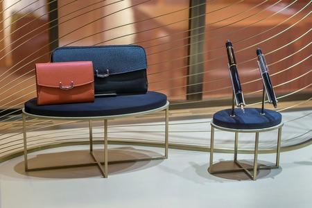 pen, and wallet in the window of a high-end boutiqueの写真素材