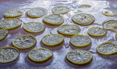 sliced lemon slices frozen in ice