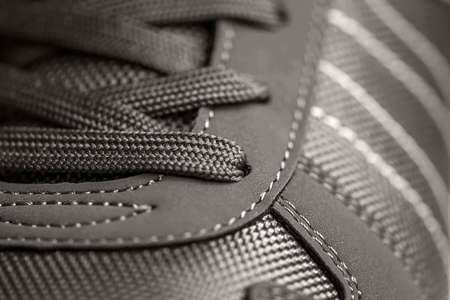 fashionable Stylish sneaker close-up texture of sports shoes knotted laces on gumshoesの写真素材