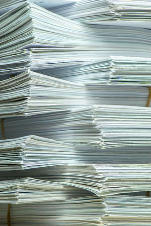 bundles bales of paper documents. stacks packs pile on the desk in the officeの写真素材