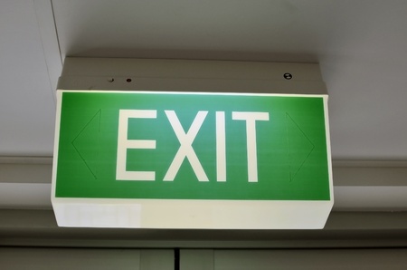 A close up of an Australian green exit sign の写真素材
