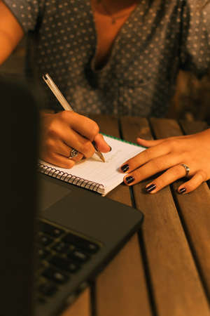 Caucasian teen girl doing her homework with a frustrating expression. Horizontal. With copy-space.