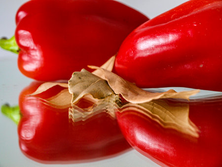 red peppers on a white background, close-up, selective focusの写真素材