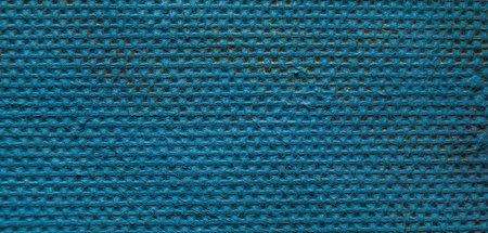 Blue knitted fabric as a background. Close-up. Macro