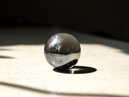 glass ball on the floor, closeup of photo with shallow depth of field