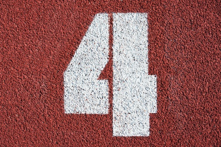 Number four on the start of a running track - check my portfolio for other numbers の写真素材