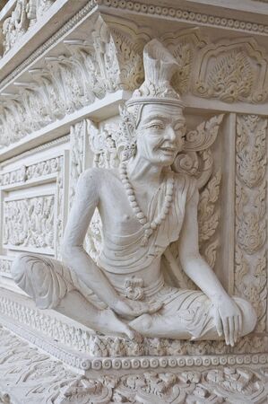 Ascetic statue in Thai style molding art at temple の写真素材