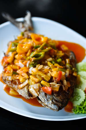 fish on dish with Sauce の写真素材