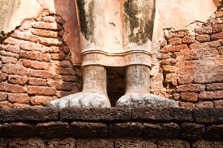 Feet of Buddha Image in Wat Phra Si lriyabot at Si Satchanalai Chaliang Historical Park, Kamphaeng Phet Province, Thailand の写真素材