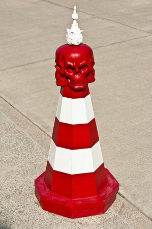 Red and White Traffic Cone with Red Skull の写真素材