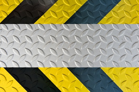 Yellow and black warning sign on Metal Plate