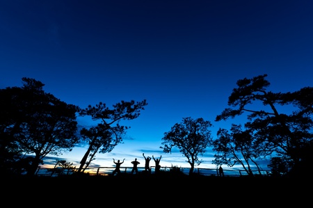 Four men on a top of a mountainの写真素材