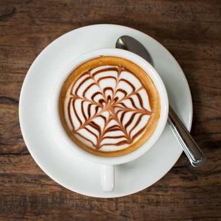 Coffee cup on wooden backgroundの写真素材